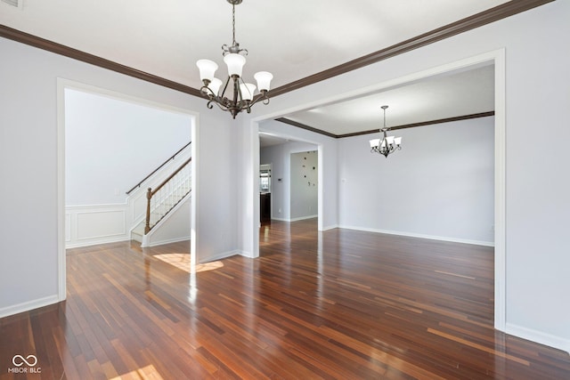 12997 Bartlett Dr, Fishers, IN 46037 - empty room with a chandelier, stairs, wood finished floors, and crown molding