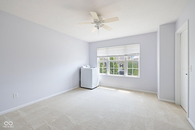 12997 Bartlett Dr, Fishers, IN 46037 - carpeted empty room featuring washer / clothes dryer and a ceiling fan