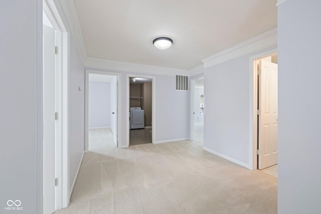 12997 Bartlett Dr, Fishers, IN 46037 - hallway with washer / clothes dryer, light colored carpet, and ornamental molding