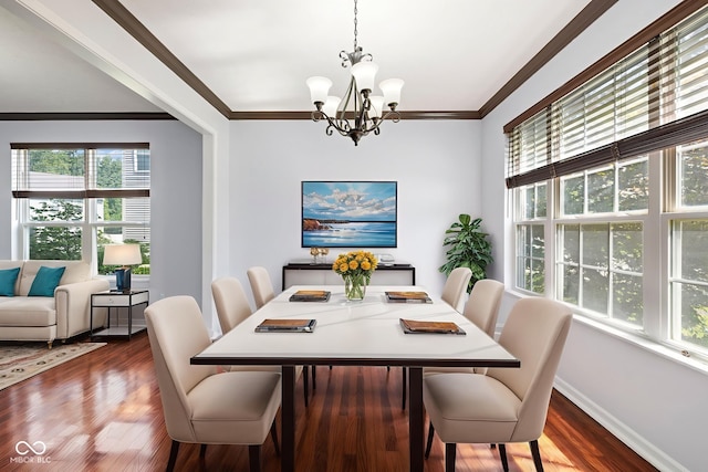 12997 Bartlett Dr, Fishers, IN 46037 - dining space featuring a chandelier, plenty of natural light, wood finished floors, and crown molding