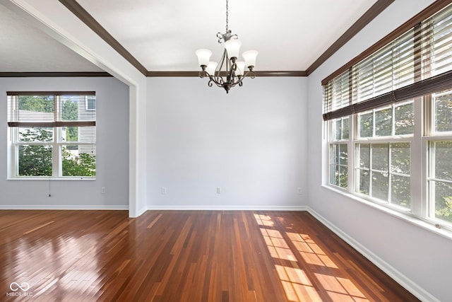 12997 Bartlett Dr, Fishers, IN 46037 - spare room featuring a chandelier, hardwood / wood-style floors, and crown molding