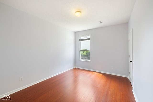 12997 Bartlett Dr, Fishers, IN 46037 - empty room with wood finished floors and baseboards