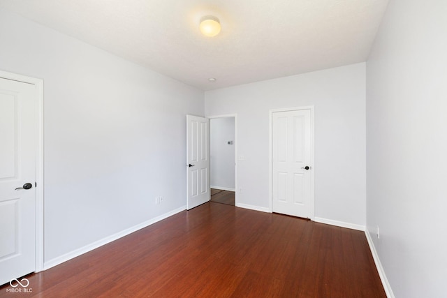 12997 Bartlett Dr, Fishers, IN 46037 - unfurnished bedroom featuring wood finished floors and baseboards