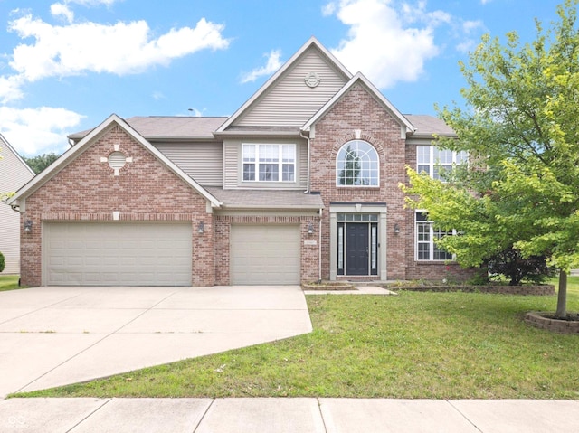 12997 Bartlett Dr, Fishers, IN 46037 - view of front of home with driveway, a front lawn, brick siding, and a garage