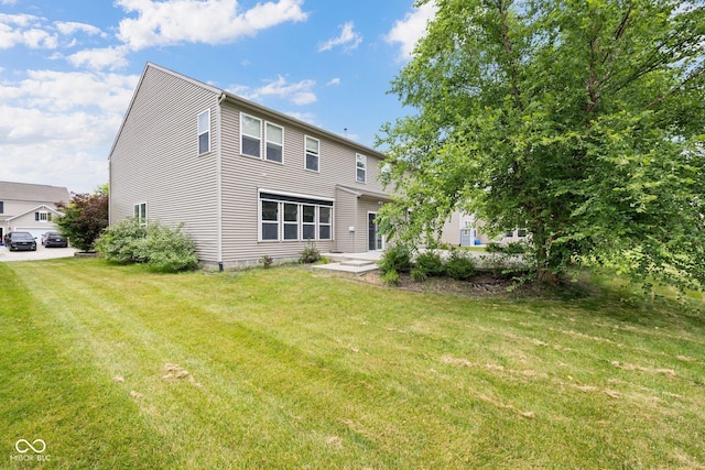 12997 Bartlett Dr, Fishers, IN 46037 - rear view of property featuring a yard