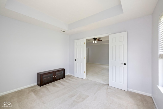 12997 Bartlett Dr, Fishers, IN 46037 - unfurnished bedroom with carpet floors and a tray ceiling