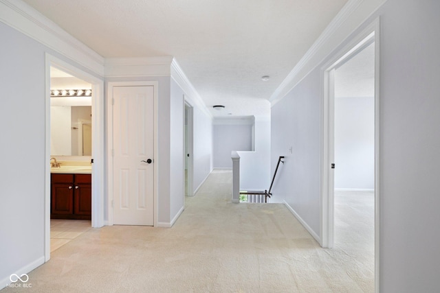 12997 Bartlett Dr, Fishers, IN 46037 - corridor featuring an upstairs landing, light carpet, and crown molding