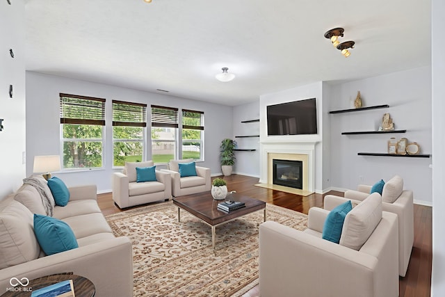 12997 Bartlett Dr, Fishers, IN 46037 - living room with wood finished floors and a fireplace with flush hearth