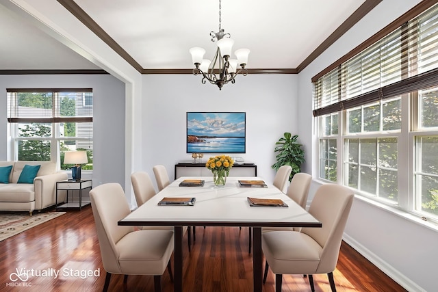 12997 Bartlett Dr, Fishers, IN 46037 - dining room featuring a chandelier, healthy amount of natural light, wood finished floors, and crown molding