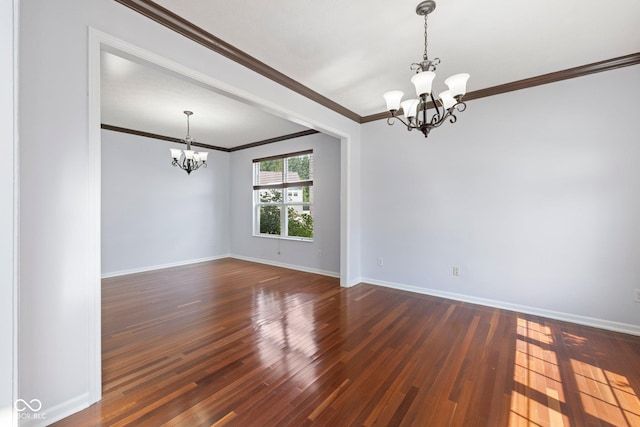 12997 Bartlett Dr, Fishers, IN 46037 - spare room with a chandelier, ornamental molding, and dark wood-style floors