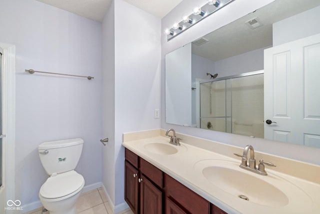 12997 Bartlett Dr, Fishers, IN 46037 - bathroom featuring double vanity, a shower with shower door, and tile patterned flooring