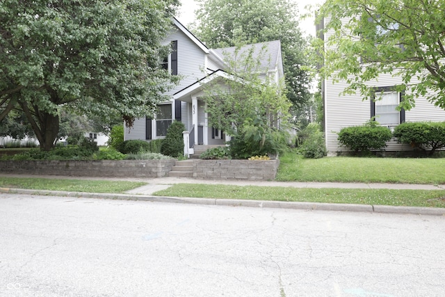 633 N E St, Greenfield, IN 46140 - obstructed view of property with a front lawn