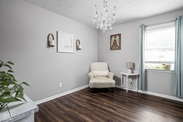 6429 Walnut Way, Brownsburg, IN 46112 - sitting room featuring a textured ceiling, a chandelier, and wood finished floors
