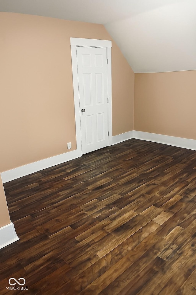 597 W Adams St, Franklin, IN 46131 - additional living space with dark wood-style floors and lofted ceiling