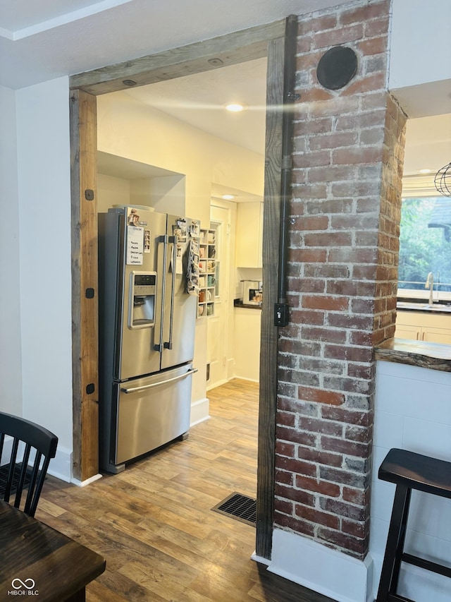 597 W Adams St, Franklin, IN 46131 - kitchen featuring stainless steel refrigerator with ice dispenser and wood finished floors