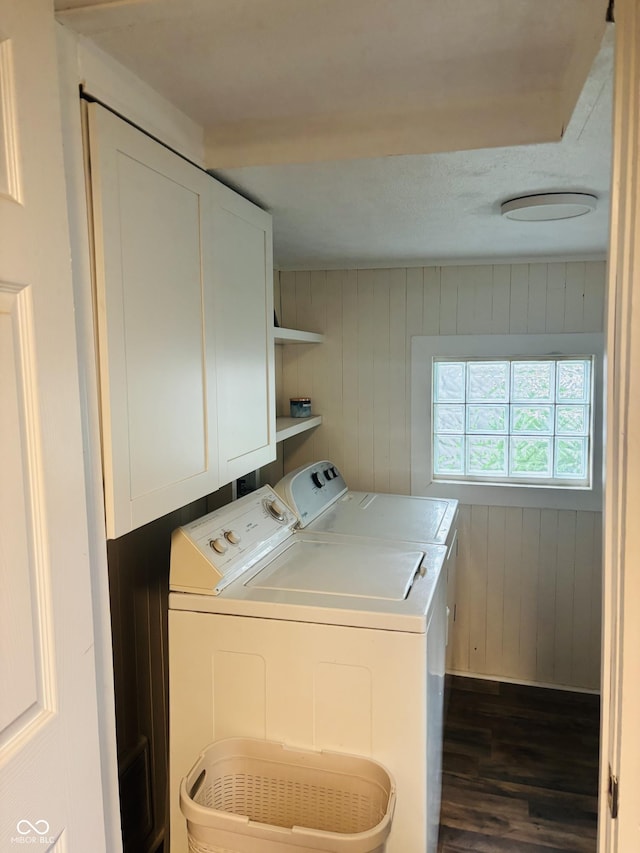 597 W Adams St, Franklin, IN 46131 - washroom with cabinet space, washing machine and dryer, dark wood-type flooring, and wooden walls