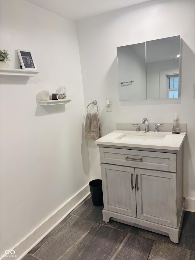 597 W Adams St, Franklin, IN 46131 - bathroom with vanity and wood finished floors