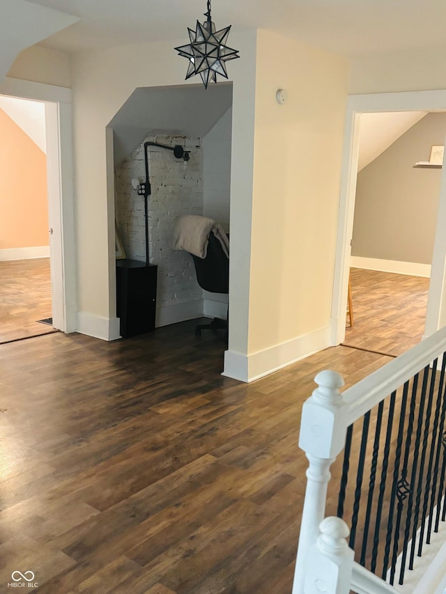 597 W Adams St, Franklin, IN 46131 - hallway featuring wood finished floors and an upstairs landing