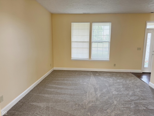 2444 Cole Branch Ct, Indianapolis, IN 46239 - entrance foyer with carpet and a textured ceiling