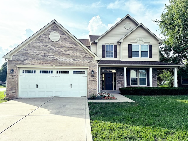 2444 Cole Branch Ct, Indianapolis, IN 46239 - view of front of house with concrete driveway, brick siding, a garage, and a front lawn