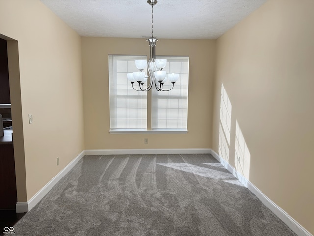 2444 Cole Branch Ct, Indianapolis, IN 46239 - unfurnished dining area featuring carpet, a chandelier, and a textured ceiling