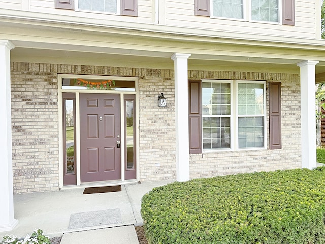 2444 Cole Branch Ct, Indianapolis, IN 46239 - view of exterior entry featuring brick siding and covered porch