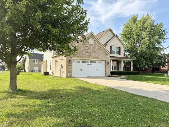 2444 Cole Branch Ct, Indianapolis, IN 46239 - view of front of house featuring a garage, brick siding, a front yard, and driveway