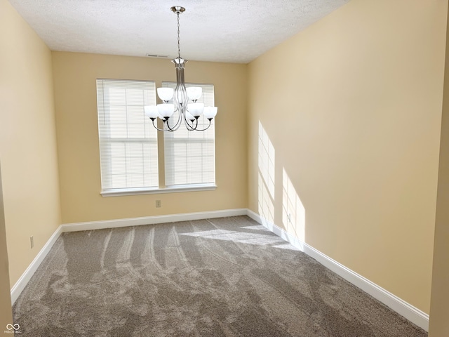 2444 Cole Branch Ct, Indianapolis, IN 46239 - spare room featuring a chandelier, carpet floors, and a textured ceiling