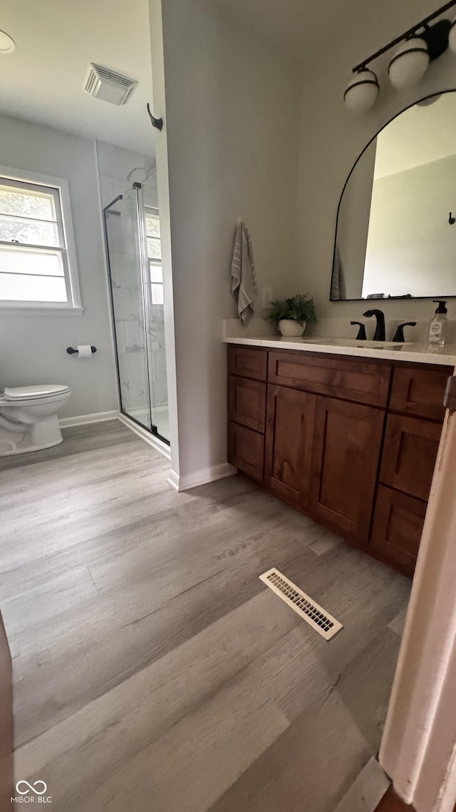 336 Brookside Ln, Plainfield, IN 46168 - full bath featuring wood finished floors, vanity, and a stall shower
