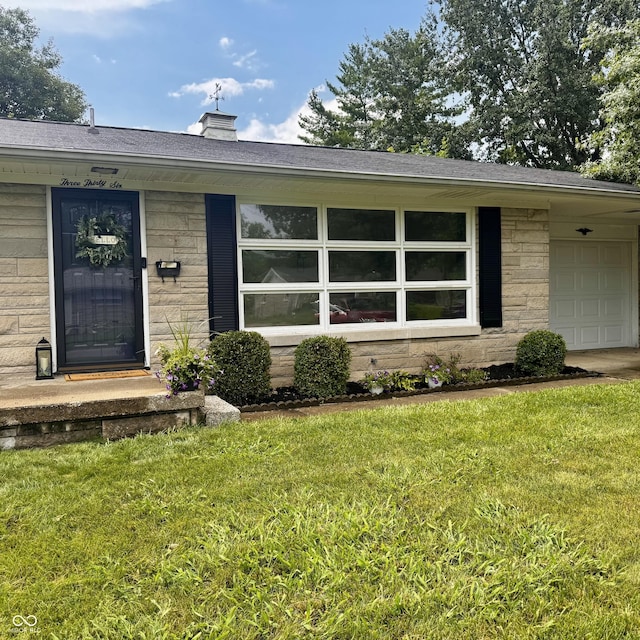 336 Brookside Ln, Plainfield, IN 46168 - entrance to property with a lawn, an attached garage, stone siding, and a chimney