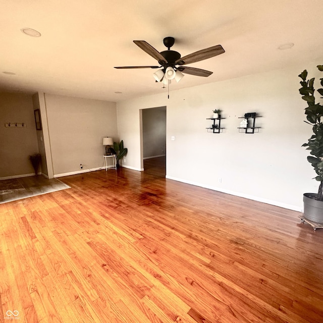 336 Brookside Ln, Plainfield, IN 46168 - unfurnished living room with wood finished floors and a ceiling fan