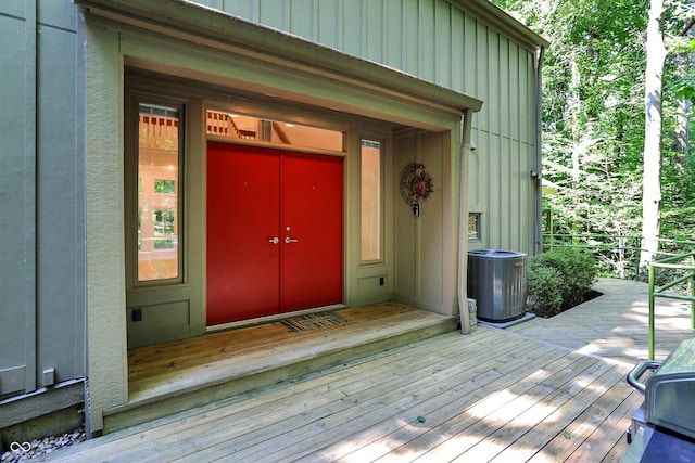 944 Briar Patch Ln, Greenwood, IN 46142 - doorway to property with board and batten siding and a wooden deck