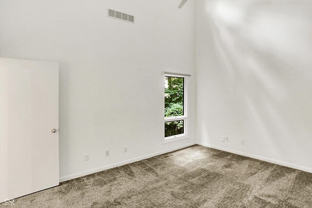 944 Briar Patch Ln, Greenwood, IN 46142 - spare room with carpet floors, a towering ceiling, and a ceiling fan