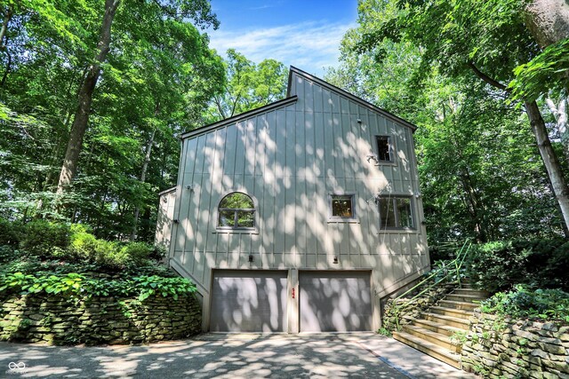 944 Briar Patch Ln, Greenwood, IN 46142 - view of home's exterior with an attached garage, driveway, and stairway