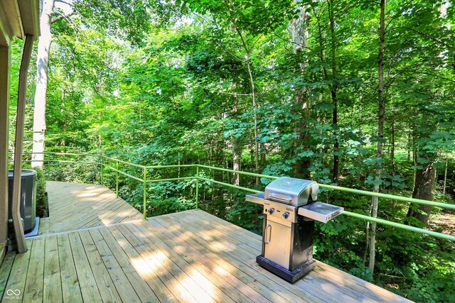 944 Briar Patch Ln, Greenwood, IN 46142 - wooden deck with a grill and a wooded view