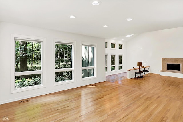 944 Briar Patch Ln, Greenwood, IN 46142 - unfurnished living room featuring recessed lighting, light wood-style floors, a premium fireplace, and lofted ceiling