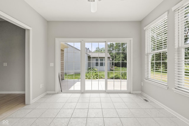 13172 Duval Dr, Fishers, IN 46037 - unfurnished room featuring plenty of natural light, light tile patterned floors, and ceiling fan