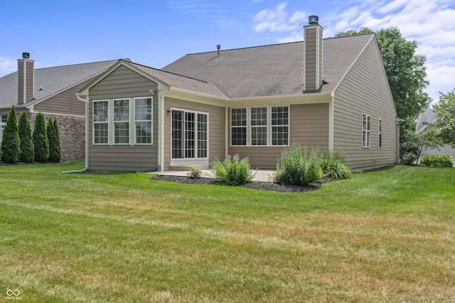 13172 Duval Dr, Fishers, IN 46037 - back of house featuring a yard, a patio, and a shingled roof