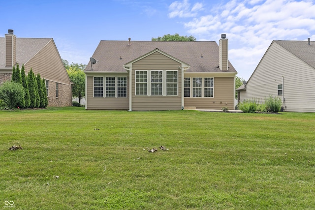 13172 Duval Dr, Fishers, IN 46037 - rear view of property featuring a lawn and a chimney
