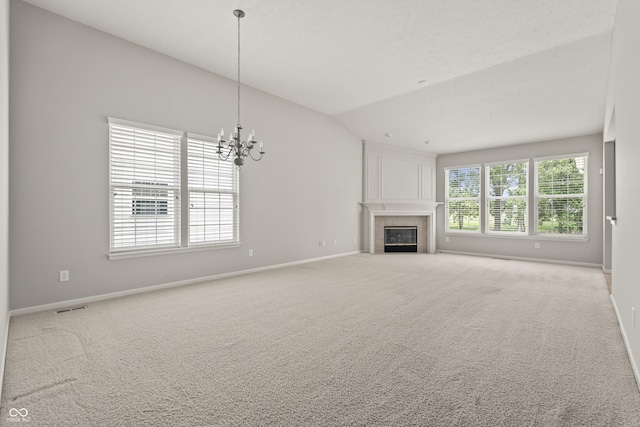13172 Duval Dr, Fishers, IN 46037 - unfurnished living room featuring a fireplace with flush hearth, a chandelier, carpet floors, and lofted ceiling