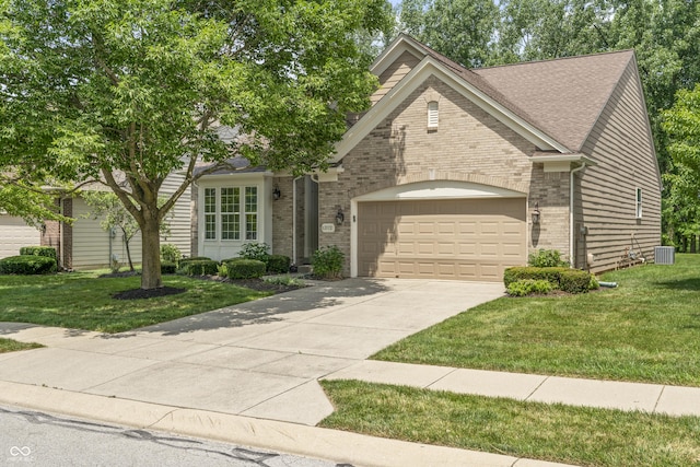 13172 Duval Dr, Fishers, IN 46037 - view of front of house with brick siding, a garage, concrete driveway, and a front lawn
