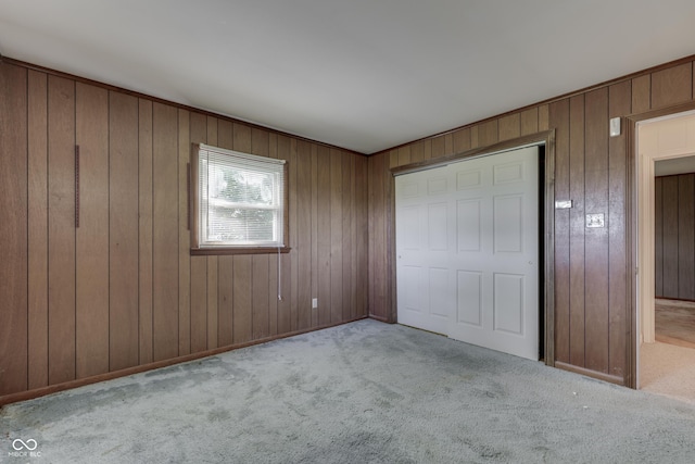 6637 E County Road 600 S, Plainfield, IN 46168 - unfurnished bedroom featuring carpet flooring, a closet, and wooden walls