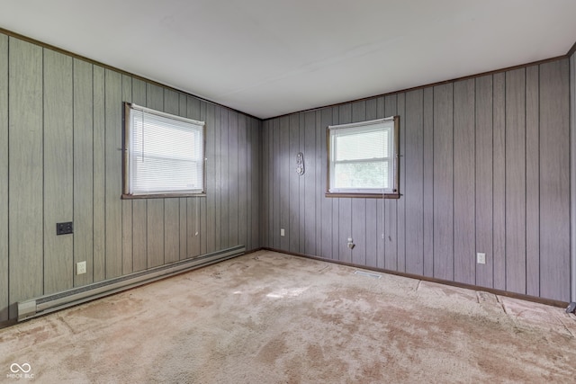 6637 E County Road 600 S, Plainfield, IN 46168 - spare room featuring baseboard heating, carpet, and wooden walls