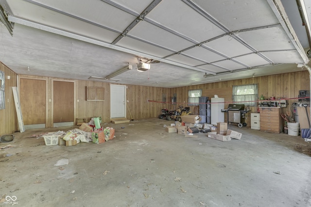 6637 E County Road 600 S, Plainfield, IN 46168 - garage featuring a garage door opener and wood walls