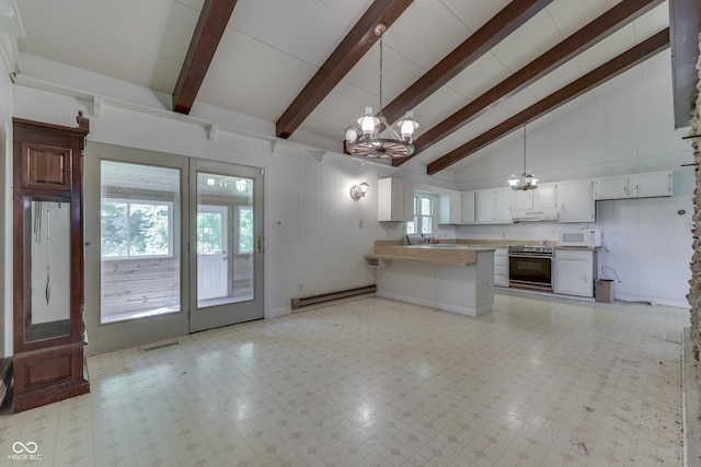 6637 E County Road 600 S, Plainfield, IN 46168 - kitchen featuring a chandelier, white microwave, stainless steel range with electric stovetop, beamed ceiling, and a peninsula