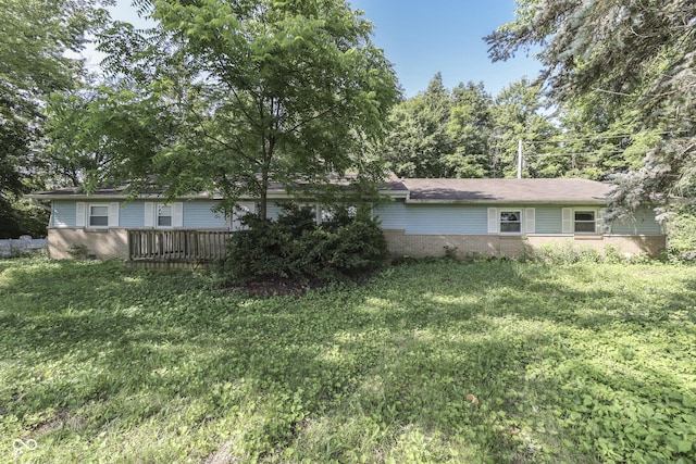 6637 E County Road 600 S, Plainfield, IN 46168 - back of property with brick siding, a yard, and a deck