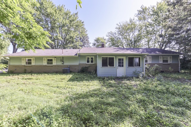 6637 E County Road 600 S, Plainfield, IN 46168 - rear view of property featuring brick siding, a chimney, and a yard