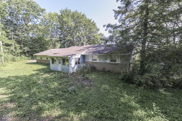 6637 E County Road 600 S, Plainfield, IN 46168 - rear view of property featuring a yard and brick siding
