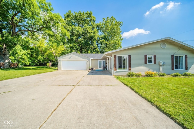 901 N Greenbriar Rd, Muncie, IN 47304 - ranch-style home with concrete driveway, a front lawn, and a garage