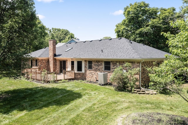 8439 Goldfinch Cir, Indianapolis, IN 46256 - rear view of property featuring a shingled roof, a chimney, brick siding, and a lawn